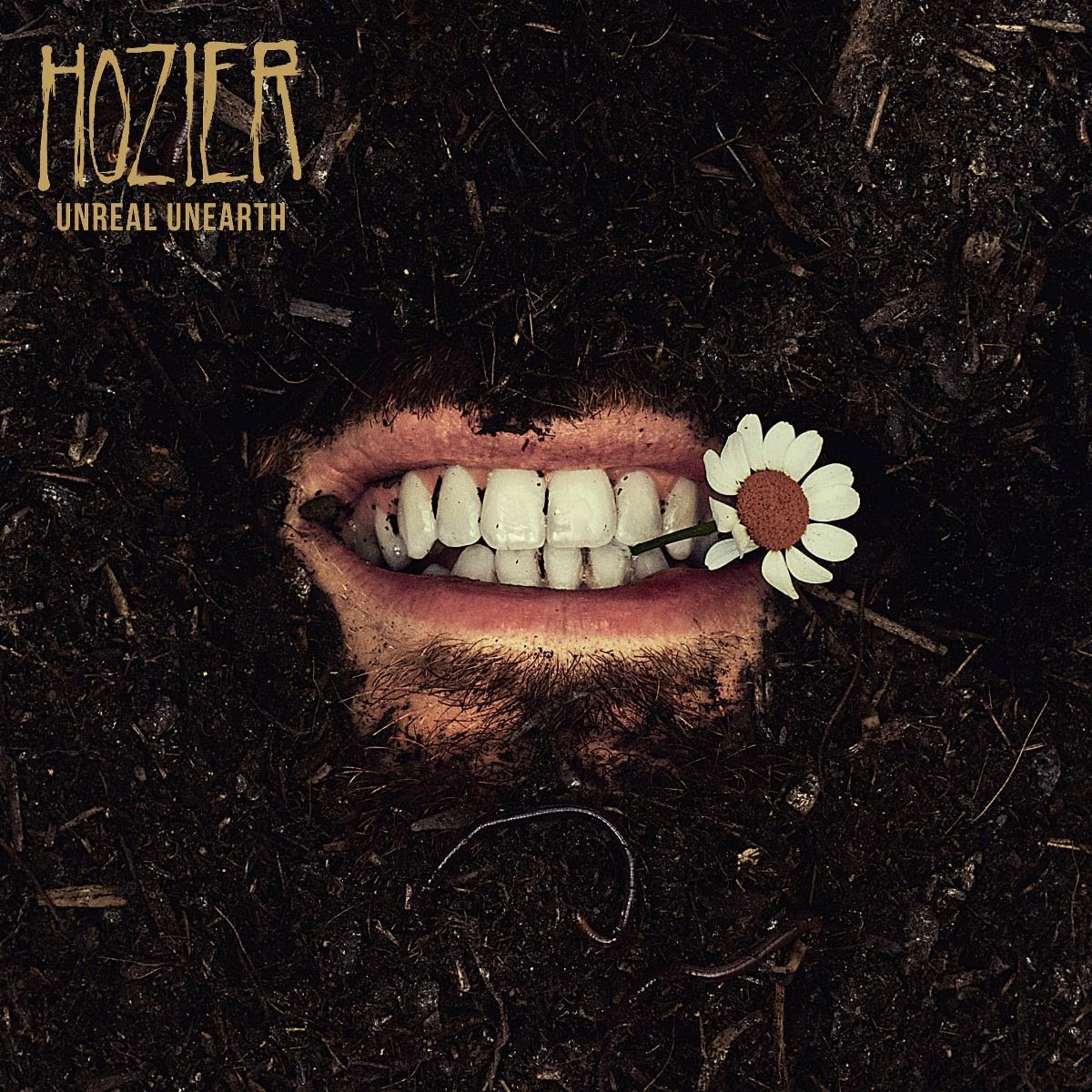 Album cover with a mouth and flower, featuring the artist 'Mozier' and title 'Unreal Unearth'.